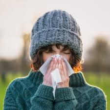 woman with cold sniffling